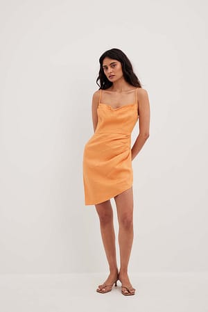 Orange Lejąca lniana sukienka w kopertowym stylu