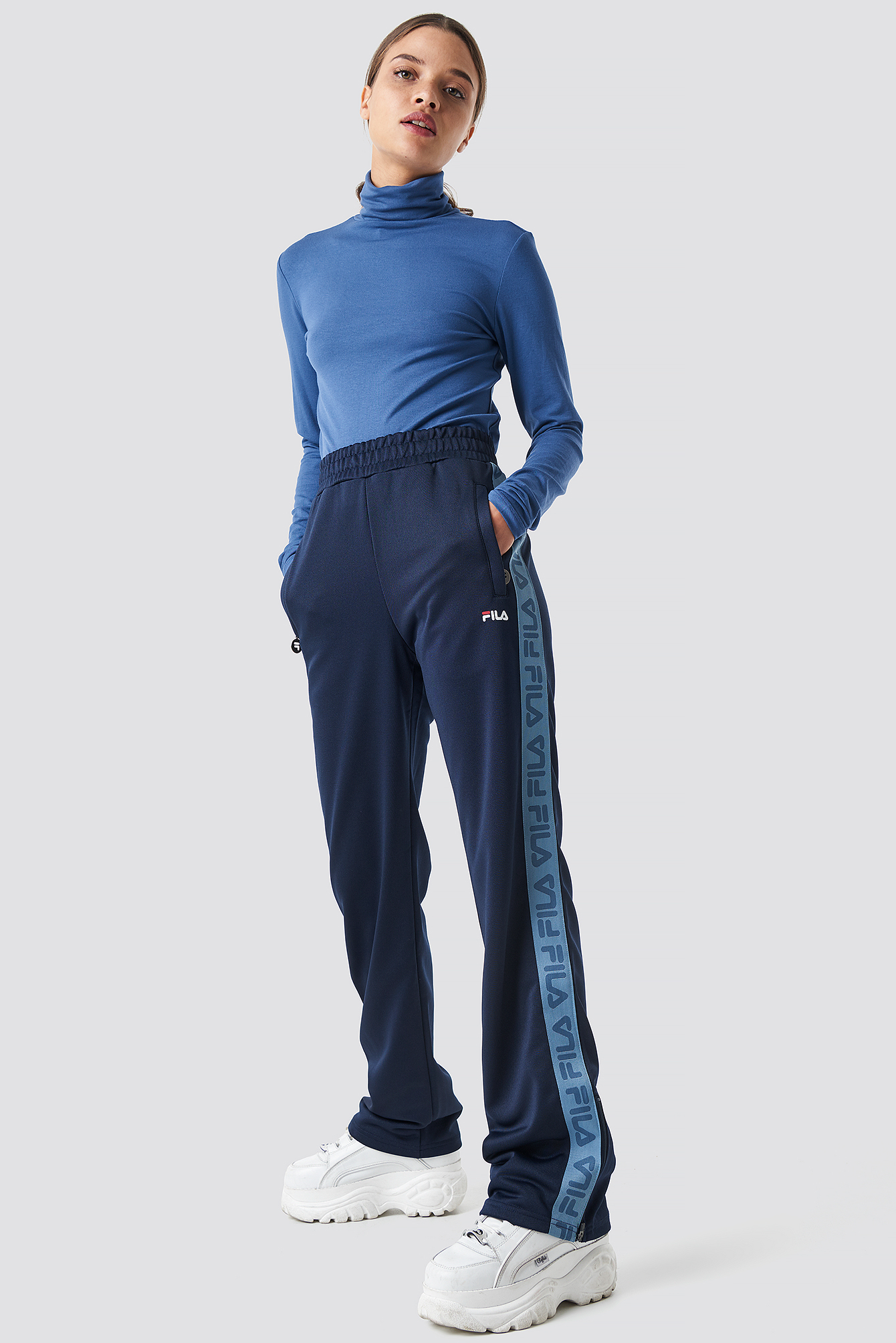 thora track pants fila