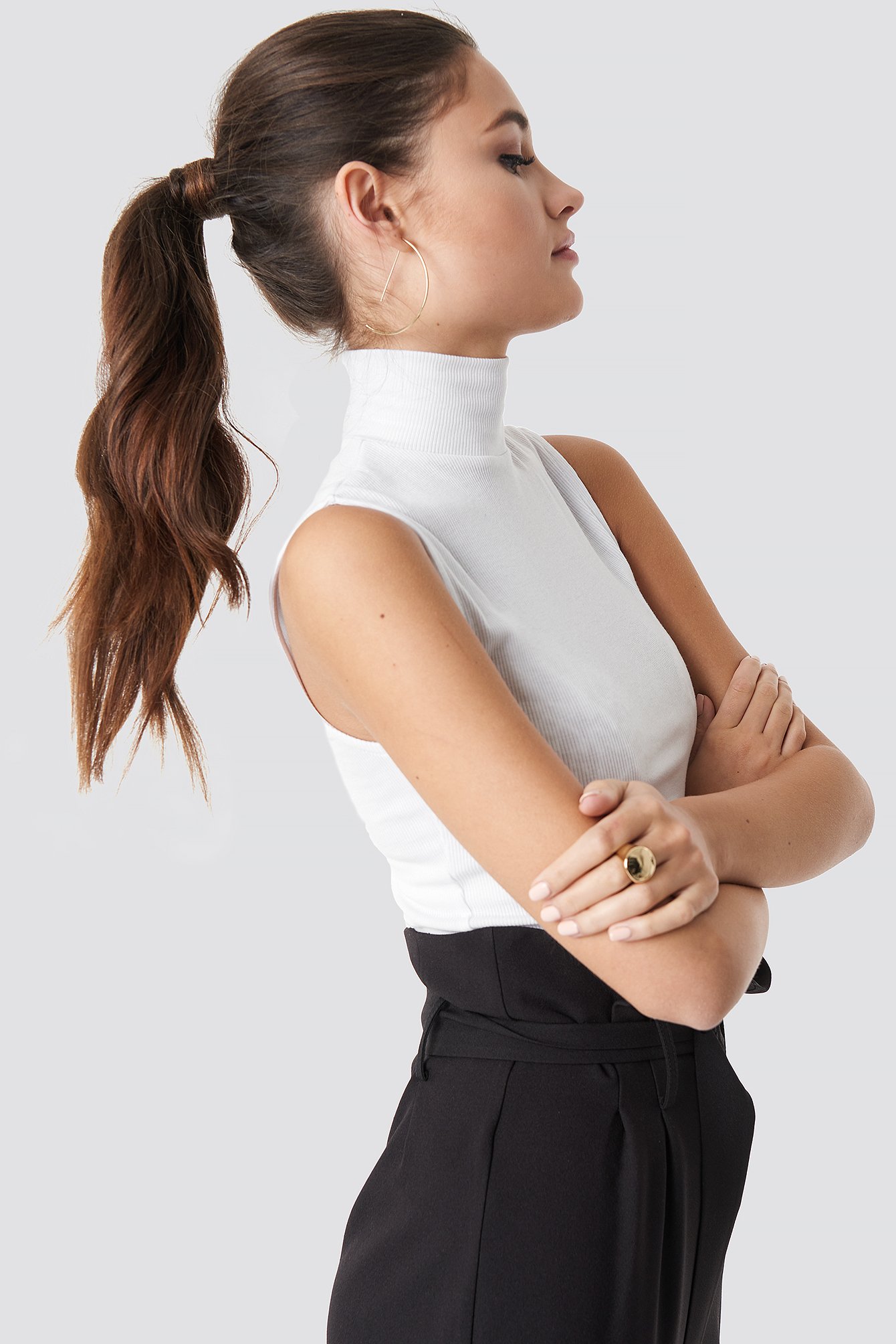 white sleeveless polo neck