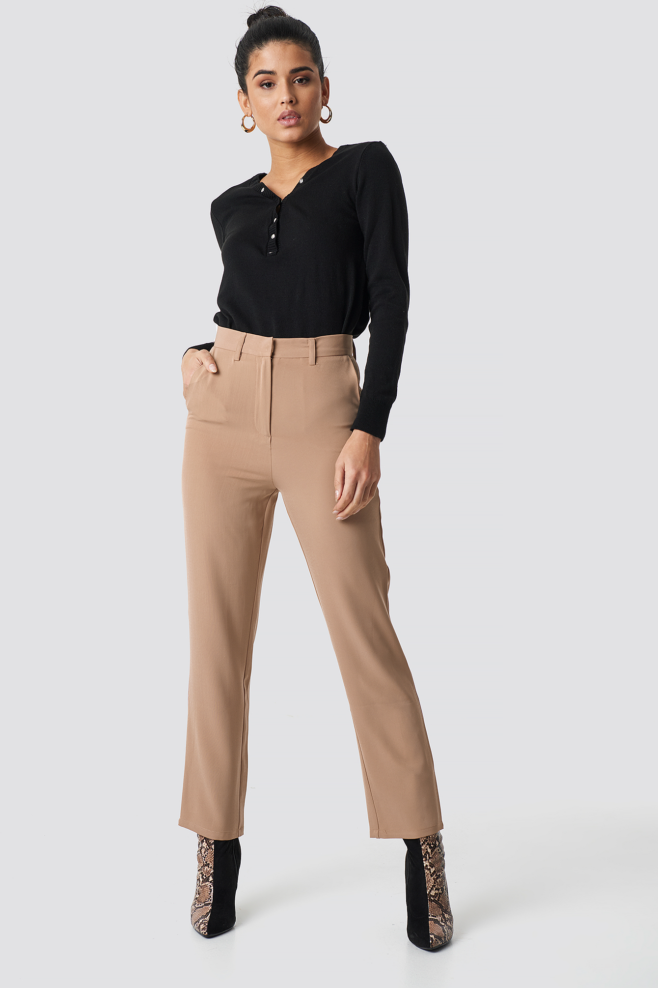 beige high waisted trousers