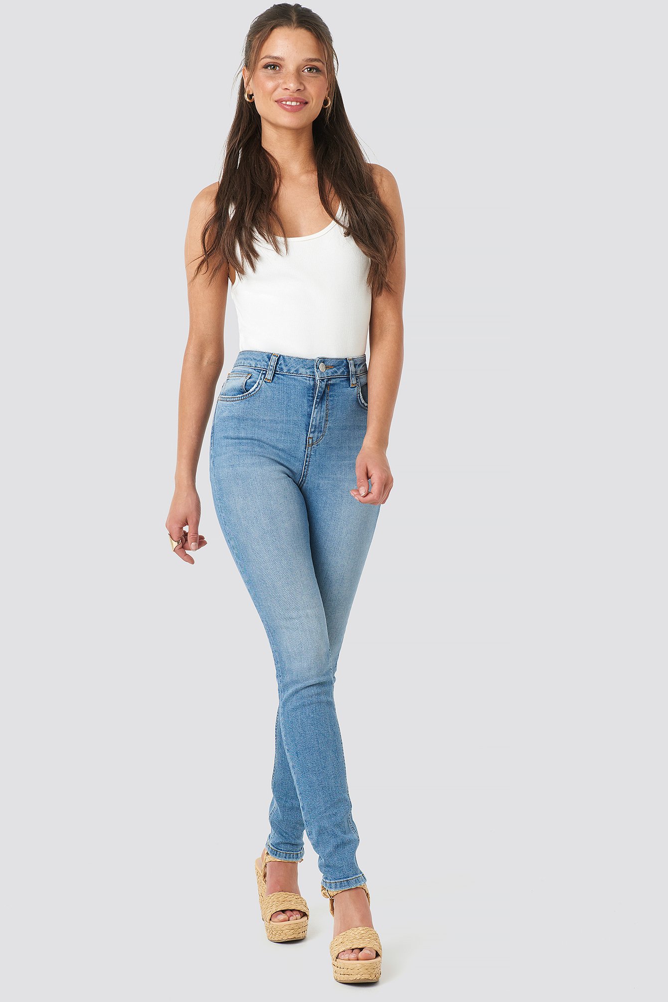 mid blue high waisted skinny jeans