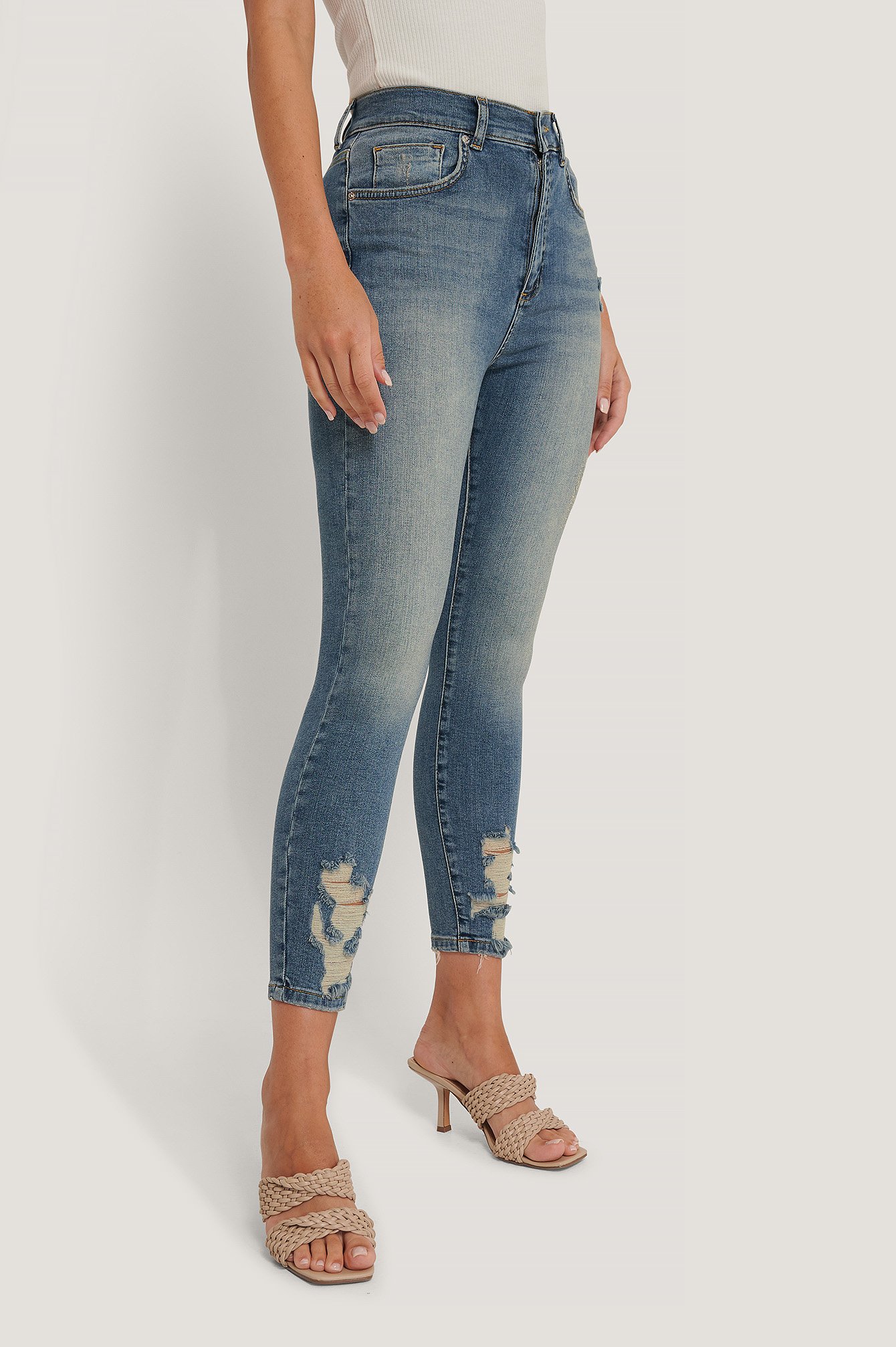 blue ripped hem skinny jeans