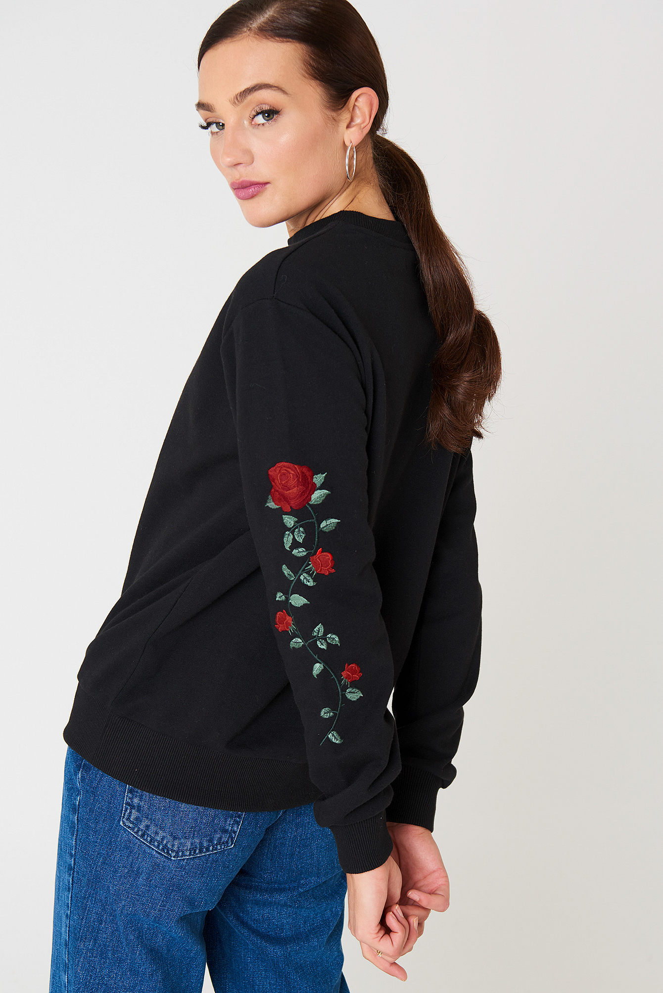 Jumper with roses on on sale sleeves