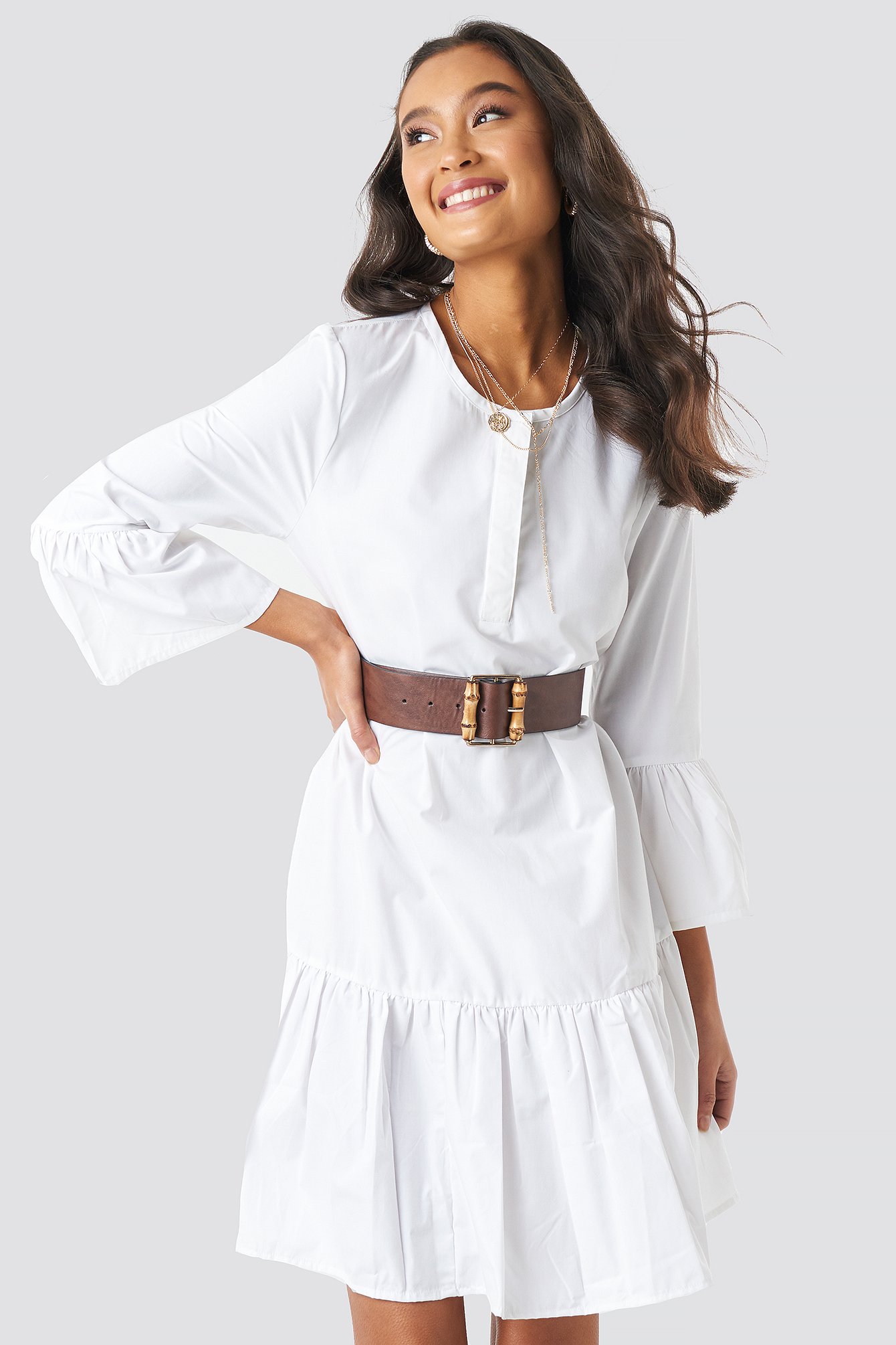 white dress with trumpet sleeves