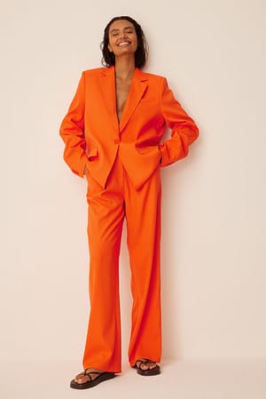 Orange Kostymbyxor med plisserade detaljer
