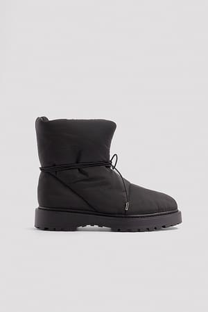 Black Puffigt quiltade ankelboots