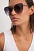 Store cateye-solbriller med tyndt stel