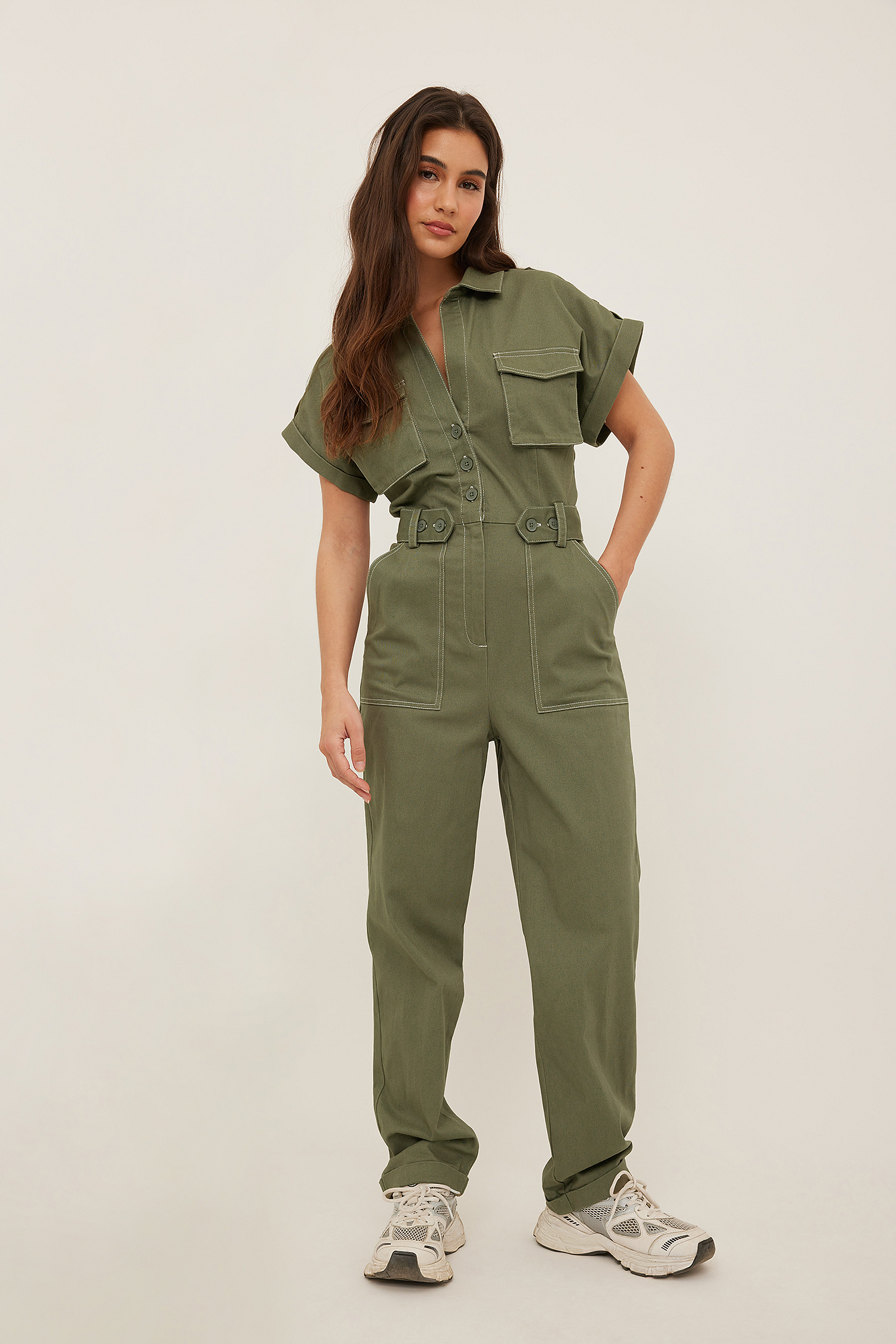 green jumpsuit with buttons