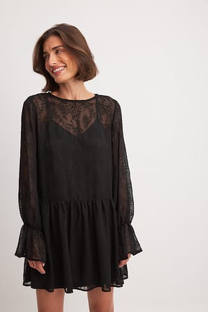 Black Strukturerad miniklänning med plisserad kjol